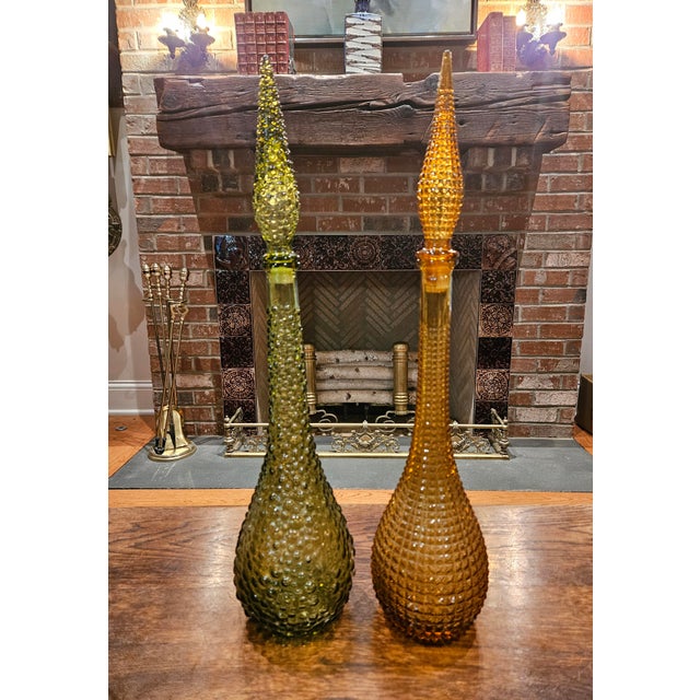 Add a vibrant pop of Mid-Century Modern style to your home with this stunning pair of authentic "Genie" bottles. Produced...