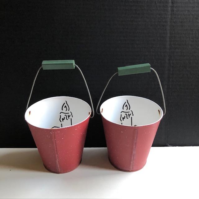 Adorable pair of tin Christmas holiday pails. With cutout decor of candle and wooden handle. Room inside for a votive...