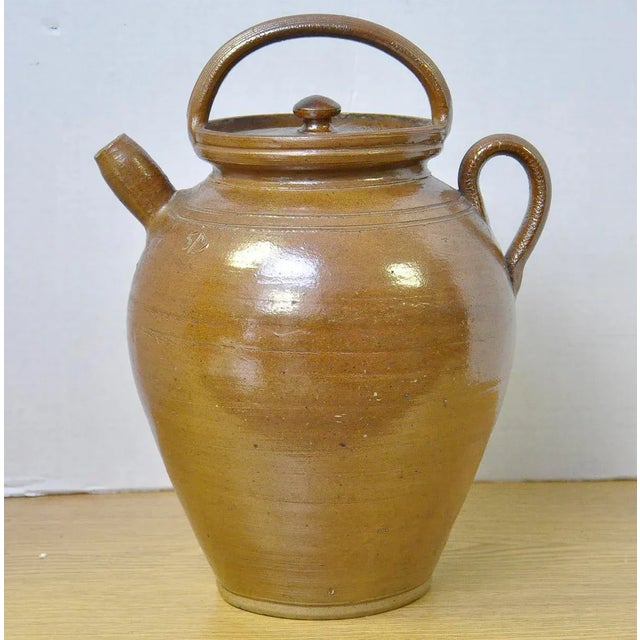 Unique vintage French Stoneware pot with lid. Glazed and hand-turned on a pottery wheel. Signed near the top of the pot....