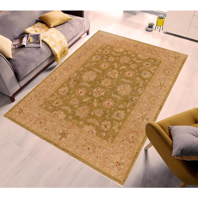 "Enhance the ambiance of your home with this magnificent Persian-influenced Turkish hand-knotted rug made by skilled...