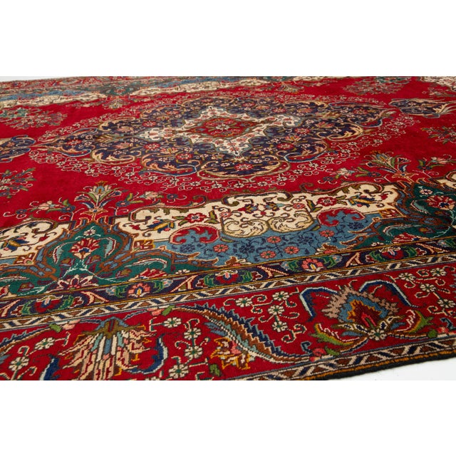 1930s This Vintage Handmade Persian Tabriz Wool Rug in a Rich Red With a Rosette Motif For Sale - Image 5 of 10