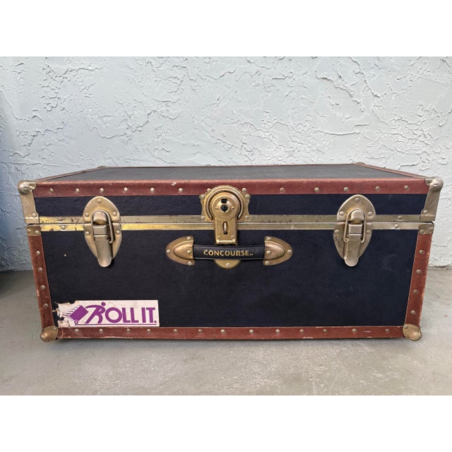 This vintage Concourse rolling travel trunk is an excellent example of late-20th-century luggage design, bridging...