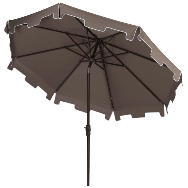 A classic market umbrella gets a chic makeover with fashion-forward gray fabric and a for extra sun protection and...