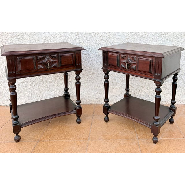 Charming pair of Spanish bedside tables dating from the mid-20th century. Crafted in wood, each table features a spacious...