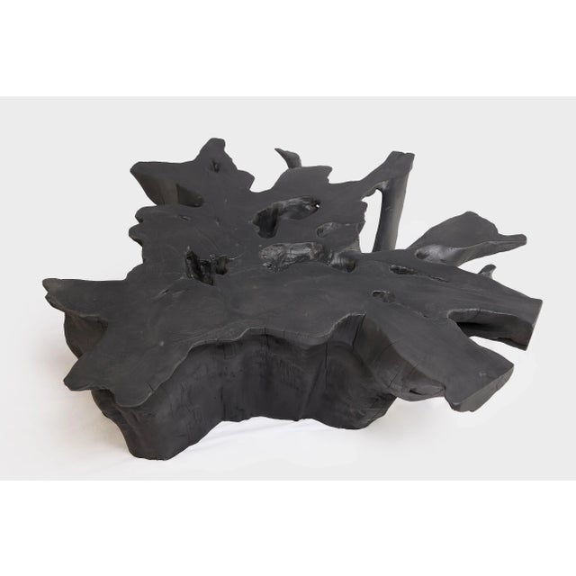 Inspired by the beauty of natural root form, this organic teak table is handcrafted from one piece of salvaged teak root....