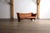 A beautiful early edition sofa model “Cayenne” in original cognac leather and coconut palm wood, made by Pacific Green in...