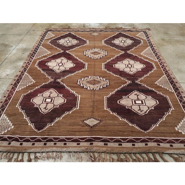 A vintage Turkish Anatolian tribal room size carpet handmade during the mid-20th century. Measures: 9' 3" x 11' 1"
