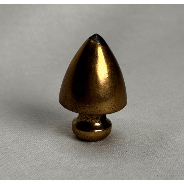 This is an actual antique solid brass plumb bob, a traditional tool used by surveyors and masons to determine a perfectly...