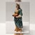 This figurine represents a standing village woman holding a tray of fruit at waist height, interpreted through classical...