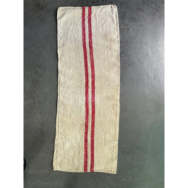 This beautiful antique grainsack is continuous in length, making it a 107” long piece. It is made of homespun linen and...