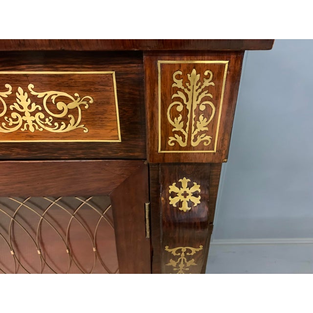 A beautiful Regency period brass inlaid rosewood chiffonier, or side cabinet. Of fine construction in solid rosewood and...