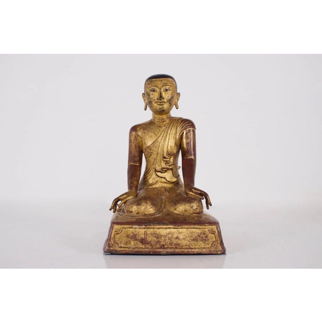 Elegant representation of the worshipper Sāriputta, one of the two most popular Buddha worshippers in Burma. Mandalay...