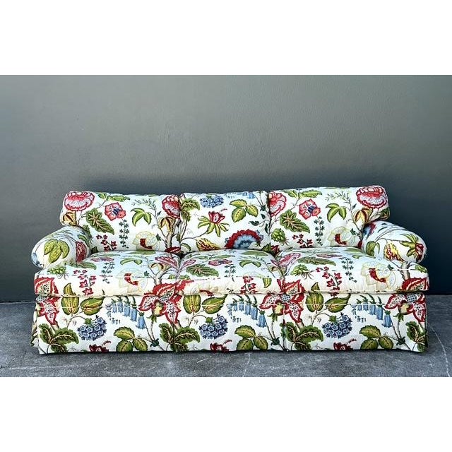 This exquisite custom-tailored sofa is a masterclass in the English Country aesthetic, dressed in the iconic "Tree of...