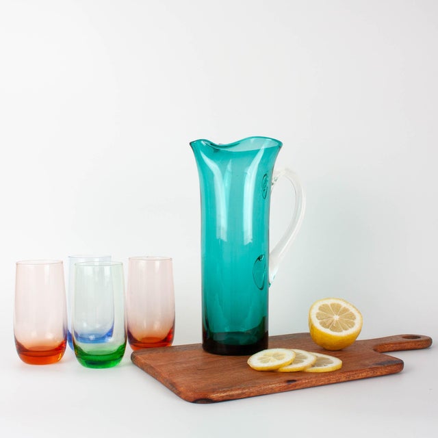 This elegant Portuguese glass jug from the 1960s is a beautiful example of the craftsmanship that made Marinha Grande one...