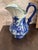 A blue and white transferware pitcher marked "Victoria Ware Ironstone" to the base, with the royal arms mark used by this...
