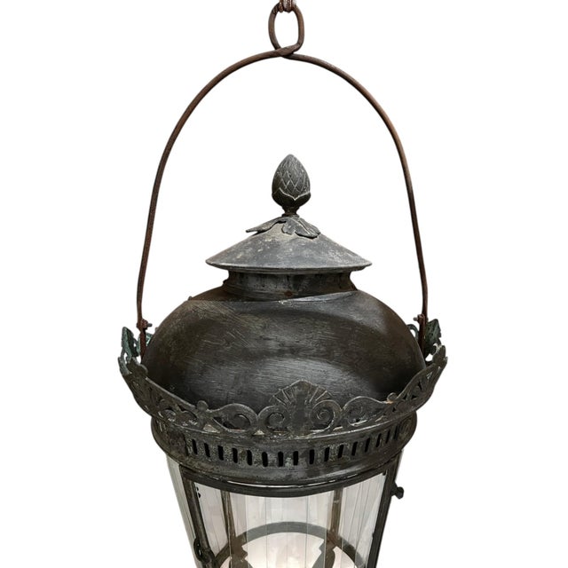 An exceptional 18th century Venetian lantern crafted in bronze and adorned with elegant neoclassical bronzework. Featuring...