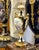 Elevate your décor with this exquisite hand-painted porcelain urn vase, featuring a romantic classical scene framed by...