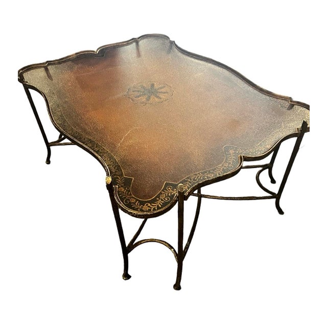 This coffee/cocktail table in the Maitland Smith style is a stunning addition to your home. With a leather top and a faux...