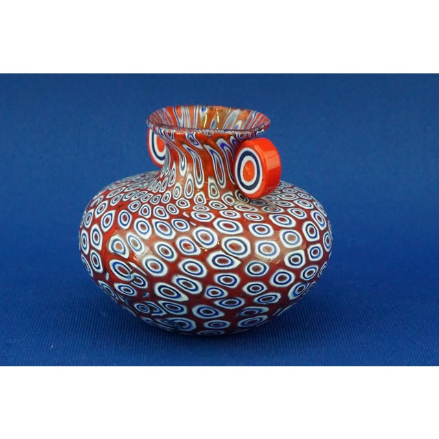 Item : A two-handled Murano glass vase, entirely handcrafted with Murrine, unsigned and dating back to the mid-20th...