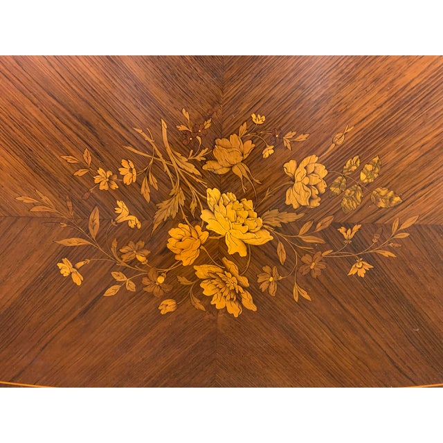 A lovely late 19th Century French inlaid rosewood table. Of fine construction and wonderful quality. The shaped top is...