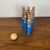 "Marine" bowling game by Vilac, 1996, France Set of 6 skittles and 1 ball made of turned wood painted in striped blue. The...
