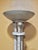 A striking embodiment of late-20th-century grandeur, this Postmodern torchiere floor lamp seamlessly references the...