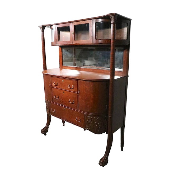 Unusual extra grade Turn of The Century Victorian oak sideboard, credenza. This piece features a curved glass showcase...
