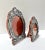 A striking pair of 1940s sterling silver repoussé oval picture frames, handcrafted in Peru. The frames feature intricate...