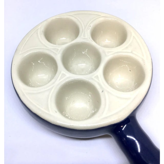 Escargot never looked so good. They were meant to be baked and served in a gorgeous deep blue ceramic dish by renowned...