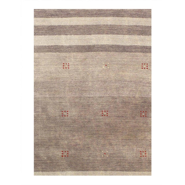 Gabbeh Rugs feature hand-spun wool in both the pile and foundation. These rugs are characterized by their abstract designs...