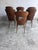 Elegant set of six vintage dining chairs by Baumann, produced in France during the 1950s. The chairs feature sculpturally...