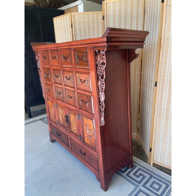 Introducing the Vintage Ming Altar Style Tall Chest - a true masterpiece of craftsmanship and style. This stunning piece...