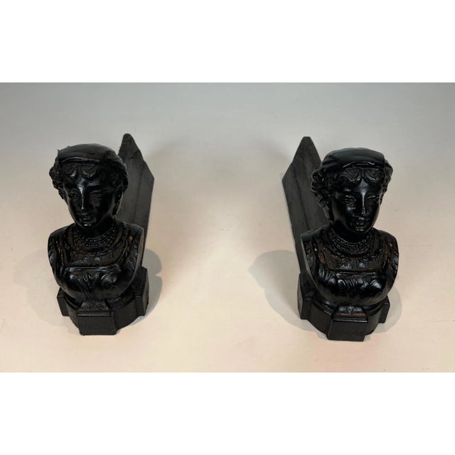 This pair of andirons is made of cast iron. They represent a woman and bear the word "Italian". This is a French work....