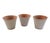 A vintage set of three clay cachepots with a pale pink crackled glaze finish. Perfect for holding small plants, small...