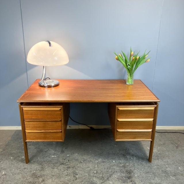 An elegant desk in the typically understated style of Danish mid-century design. The meticulous attention to detail, such...