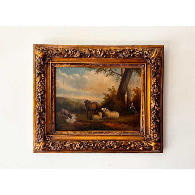Beautiful antique pastoral oil painting depicting a peaceful pastoral landscape with sheep grazing beside a quiet stream....