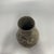 This exquisite vintage metal vase features a classic pear shape and is heavily decorated with intricate bas-relief motifs....