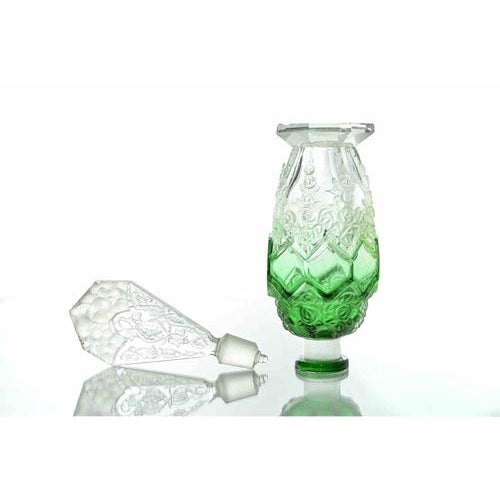 Beautiful Art Deco perfume bottle in the style of René Lalique. Opaline glass with emerald green shades. Includes its...