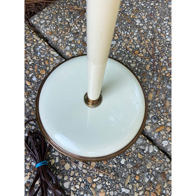 A beautiful mid twentieth century toleware floor lamp in creamy off white and brushed brass. Easily adjustable in height...