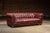 English Vintage Deep Red Leather Tufted Chesterfield Sofa With Brass Nailhead Trim For Sale - Image 3 of 9