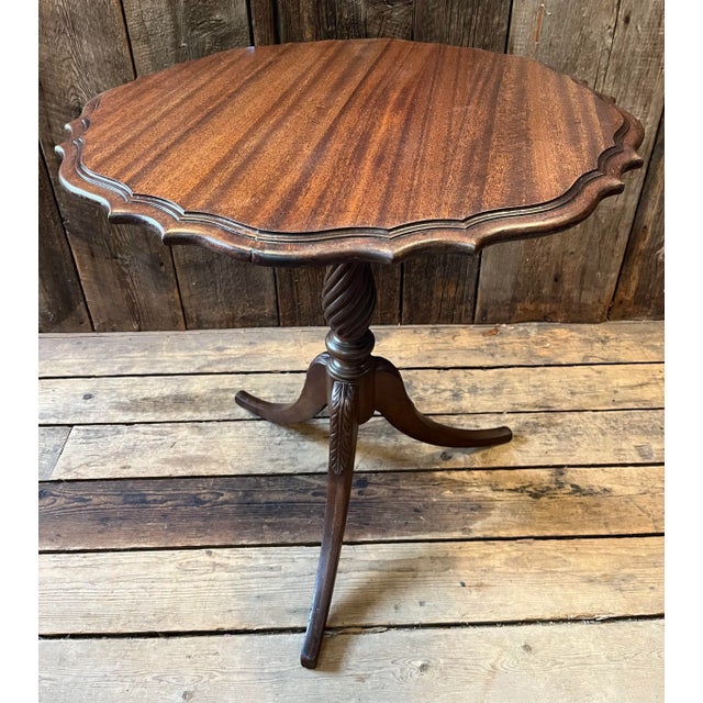 Vintage Pie Crust three legged table. Fluted and carved base. The top has been refinished. Nice size and very stable....