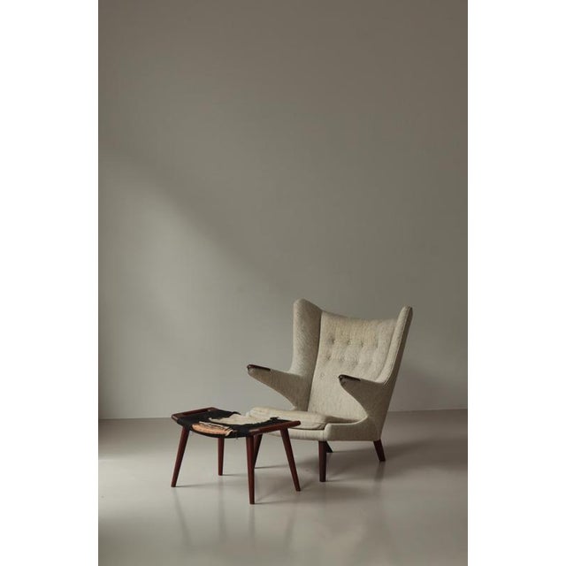 An exceptional and authentic mid-century masterpiece, this original Hans J. Wegner “Papa Bear” chair with its...