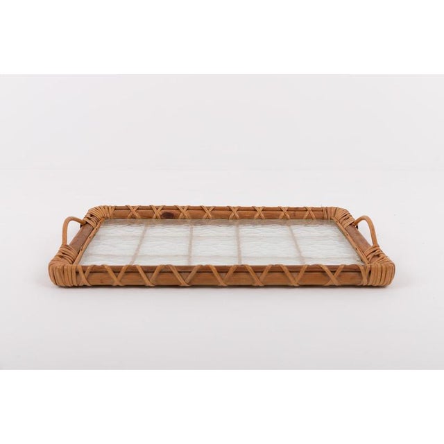 Beautiful Italian design wicker serving tray with glass plate from 1970’s.Condition Good, age related usage marks I have...