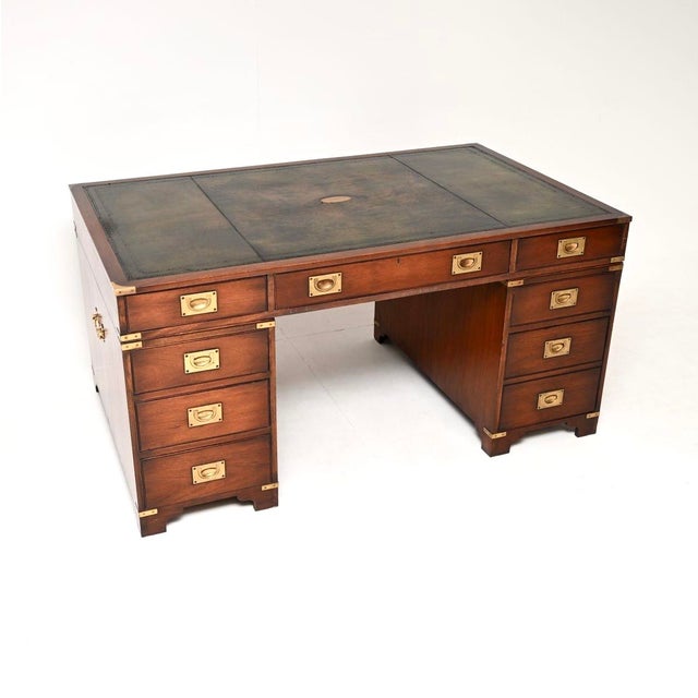 A fantastic antique military campaign style partners desk. This was made in England, it dates from around the 1950’s. It...