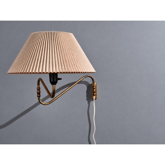 Danish Mid-Century Modern, Articulating Wall Light or Sconce, Patinated Brass, Denmark, 1950s A Danish Mid-Century Modern...