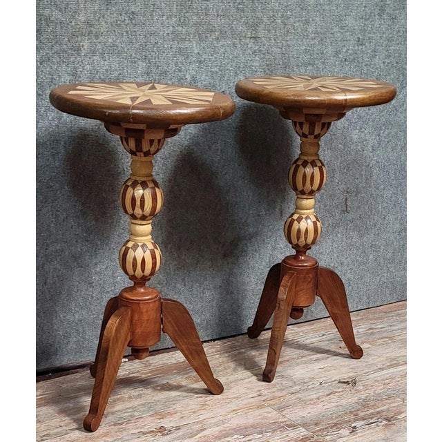 Pair of small marquetry side tables or pedestals, late 19th century. Top and stem with geometric patterns. Tripod base....