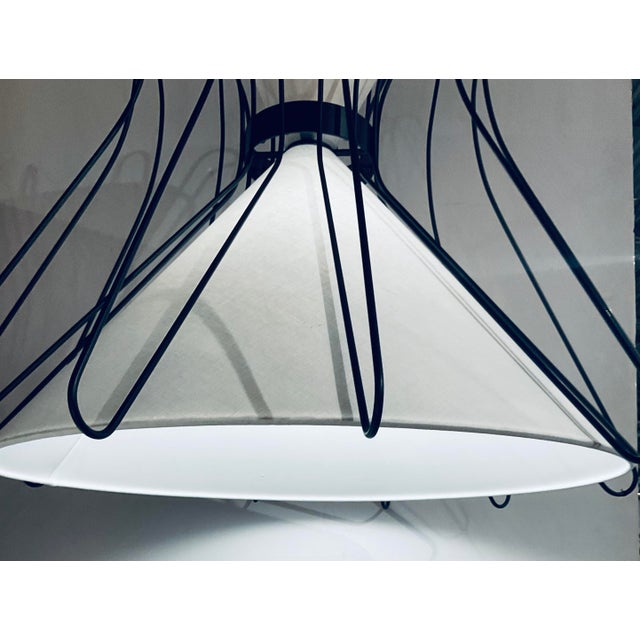 Stylish Revelation Black & White 4 Light Boomerang Pendant, cola finished black metal frame, white linen hourglass shade,...