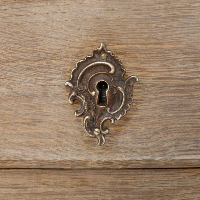 19th Century French Louis XV Style Oak Chest of Drawers. This beautifully shaped chest embodies the graceful curves and...