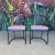 This is a rare and unique set of 6 80s postmodern iron patio chairs. They feature an upholstery blue seat base and a...