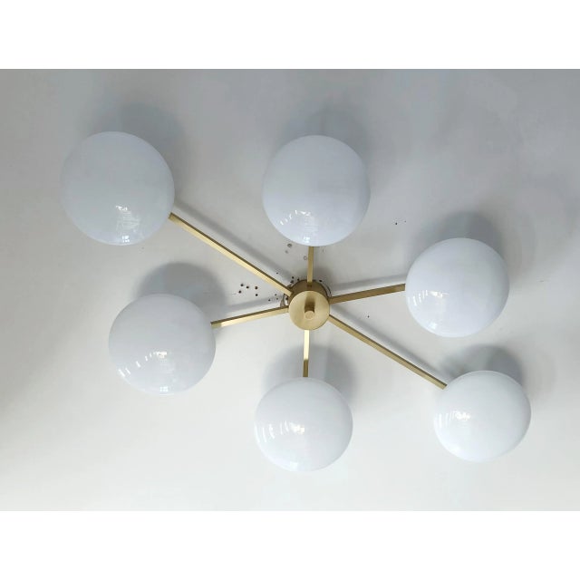 Italian asymmetrical flush mount with six glossy white Murano glass shades mounted on satin brass frame / Made in Italy...